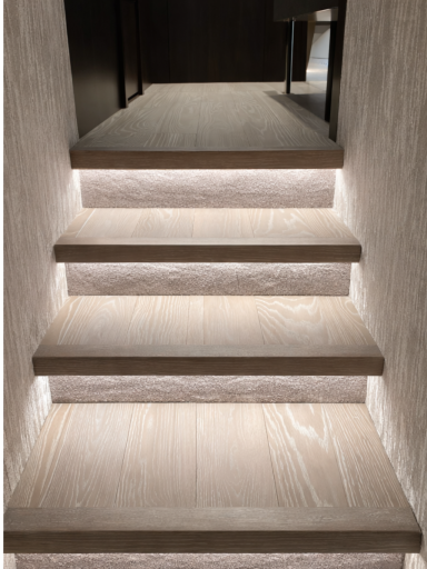 Bespoke wooden staircase with integrated LED lighting installed during a home renovation in BCP